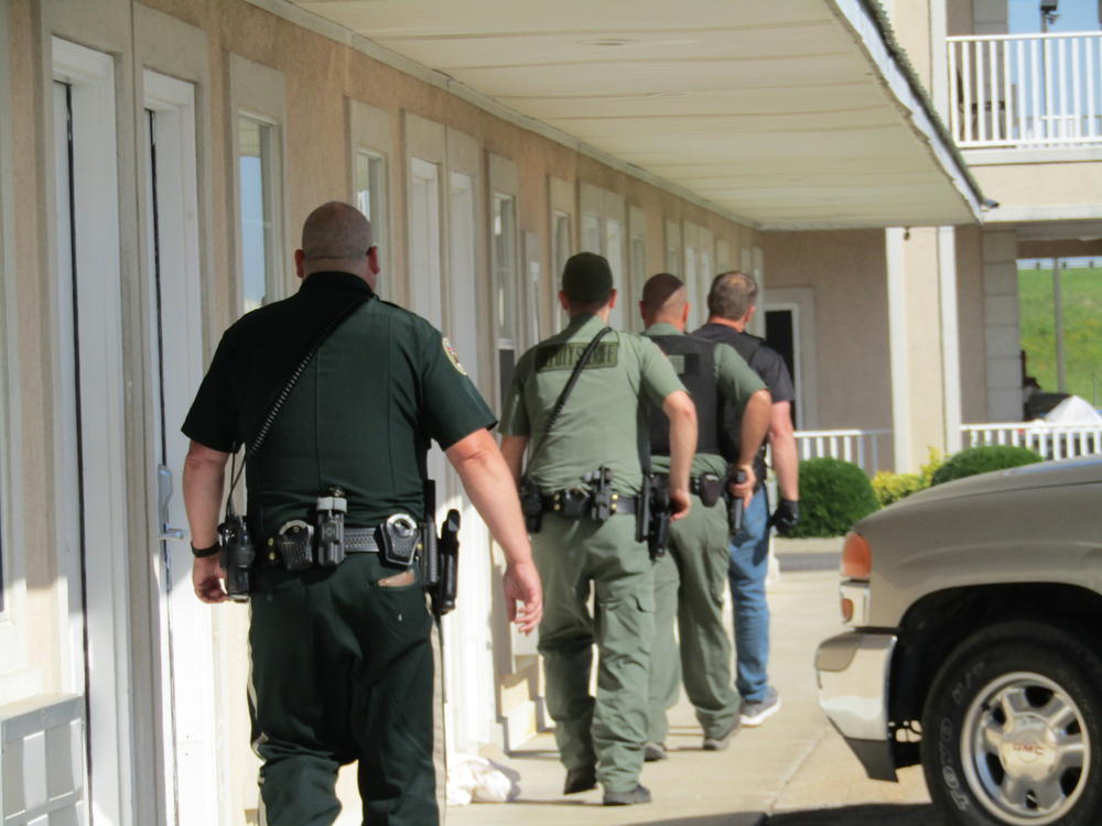 deputies walking outside building entrances