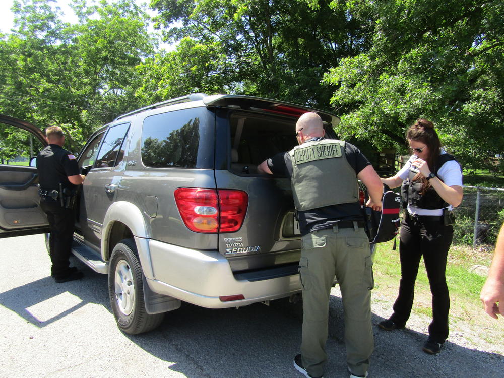 deputies searching vehicle
